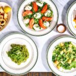 Overhead shot of table with chitarra, caprese, and spaghetti