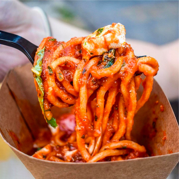 Close up of a bucatini amatriciana spaghetti cone