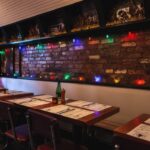 Cozy restaurant interior with exposed brick and dim lights